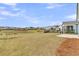 Large backyard with a pond and fountain view, fenced area, and outdoor living space at 202 Garden Gate Way, Summerville, SC 29486