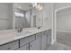 Bathroom features double vanity, modern fixtures, and a glass-enclosed shower at 202 Garden Gate Way, Summerville, SC 29486