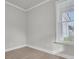 Bedroom featuring wood floors, light walls and a large window for natural light at 202 Garden Gate Way, Summerville, SC 29486