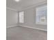 Spacious bedroom with soft carpet, two windows, and neutral paint at 202 Garden Gate Way, Summerville, SC 29486