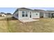 Back of the home featuring a patio and manicured lawn with green surroundings at 202 Garden Gate Way, Summerville, SC 29486
