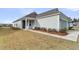 Charming one-story home with manicured lawn and walkway leading to the front door at 202 Garden Gate Way, Summerville, SC 29486