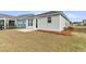 Back of the home featuring a patio, manicured lawn, and peaceful neighborhood surroundings at 202 Garden Gate Way, Summerville, SC 29486