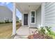 Inviting front porch with manicured greenery and a view of the lovely neighborhood at 202 Garden Gate Way, Summerville, SC 29486