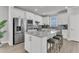Bright kitchen features stainless steel appliances, island with seating, and white cabinets at 202 Garden Gate Way, Summerville, SC 29486