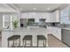 Contemporary kitchen featuring white cabinets, stainless steel appliances, and a large island at 202 Garden Gate Way, Summerville, SC 29486