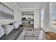 Cozy living room with neutral color scheme, stylish furniture, and bright light from windows at 202 Garden Gate Way, Summerville, SC 29486