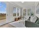 Sunlit sitting room with stylish furniture, bright windows, and neutral color scheme at 202 Garden Gate Way, Summerville, SC 29486