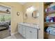Bathroom with double sinks and decorative mirrors next to a bedroom at 213 Travelers Rest Blvd, Summerville, SC 29485