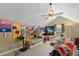 Bedroom featuring an unusual sloped ceiling, ceiling fan, and bright paintings at 213 Travelers Rest Blvd, Summerville, SC 29485