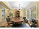 Bright dining area with large windows, elegant trim, and hardwood flooring at 213 Travelers Rest Blvd, Summerville, SC 29485