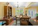 Cozy dining room with hardwood floors, natural light, and an antique cabinet at 213 Travelers Rest Blvd, Summerville, SC 29485