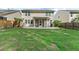Large backyard with green grass and a view of the home's screened porch at 215 Overcup Loop, Summerville, SC 29486