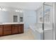 Bathroom features soaking tub, large window, and double vanity with dark wood cabinets at 215 Overcup Loop, Summerville, SC 29486