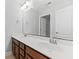 Bathroom boasts a double vanity with granite counters and a large mirror at 215 Overcup Loop, Summerville, SC 29486