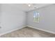 Cozy bedroom with a ceiling fan, a window, and neutral-colored walls and flooring at 215 Overcup Loop, Summerville, SC 29486