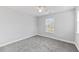 A cozy bedroom features neutral walls, plush carpeting, and a ceiling fan at 215 Overcup Loop, Summerville, SC 29486