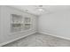 A bedroom featuring plush carpeting and two windows at 215 Overcup Loop, Summerville, SC 29486