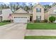 Charming two-story home with an attached two-car garage and a well-maintained front yard at 215 Overcup Loop, Summerville, SC 29486