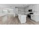 Open-concept kitchen featuring an island and a view to the dining area at 215 Overcup Loop, Summerville, SC 29486