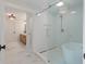 Modern bathroom featuring a glass-enclosed shower, a freestanding tub, and sleek fixtures at 2226 Red Fern Lane, Mount Pleasant, SC 29466