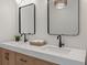 Close up of stylish double vanity with a marble countertop and modern fixtures at 2226 Red Fern Lane, Mount Pleasant, SC 29466