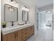 Bathroom featuring double vanity, stylish mirrors, modern lighting, and marble floors at 2226 Red Fern Lane, Mount Pleasant, SC 29466