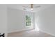 Bright bedroom with hardwood floors, large window, and modern ceiling fan at 2226 Red Fern Lane, Mount Pleasant, SC 29466
