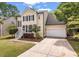 Two story house with black shutters, manicured lawn, attached garage, and tidy landscaping at 2226 Red Fern Lane, Mount Pleasant, SC 29466