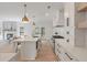 Open kitchen with stainless steel appliances, island with seating, and view to the living room and backyard at 2226 Red Fern Lane, Mount Pleasant, SC 29466