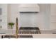 Bright kitchen featuring white subway tile backsplash, white cabinetry, and stainless steel appliances at 2226 Red Fern Lane, Mount Pleasant, SC 29466