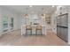 Bright kitchen with an island, stylish pendant lighting, stainless steel appliances, and a door leading to the outside at 2226 Red Fern Lane, Mount Pleasant, SC 29466