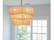 Modern lighting fixture in a sunlit room, complemented by a view of lush greenery outside the window at 2226 Red Fern Lane, Mount Pleasant, SC 29466
