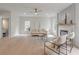Spacious living room features a ceiling fan, a fireplace, and bright natural light, perfect for relaxing and entertaining guests at 2226 Red Fern Lane, Mount Pleasant, SC 29466