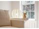 A decorated living room shows a decorative side table with a lamp and some natural lighting through the bright window at 2226 Red Fern Lane, Mount Pleasant, SC 29466