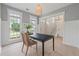 Bright and airy office space with ample natural light, minimalist decor, and hardwood floors at 2226 Red Fern Lane, Mount Pleasant, SC 29466