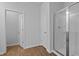 Bathroom featuring walk-in shower with glass doors and linen closet at 2243 Macallan Blvd, Ravenel, SC 29470