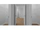 A view of multiple closets leading to a bedroom with hardwood floors at 2243 Macallan Blvd, Ravenel, SC 29470