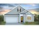 Charming single-Gathering home with a well-manicured lawn and attached garage at 2259 Macallan Blvd, Ravenel, SC 29470