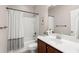 Well-lit bathroom with a shower-tub combo and a vanity with a white countertop at 2519 Rutherford Way, Charleston, SC 29414