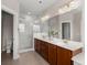 Modern bathroom with a double vanity, quartz countertop, and glass-enclosed shower at 2519 Rutherford Way, Charleston, SC 29414