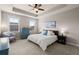 Serene bedroom features a tray ceiling, neutral paint, plush carpet, and ample natural light at 2519 Rutherford Way, Charleston, SC 29414