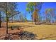 Community park and greenspace with mature trees and homes in the background at 2519 Rutherford Way, Charleston, SC 29414