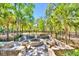 Outdoor fire pit featuring Adirondack chairs in a fenced community green space at 2519 Rutherford Way, Charleston, SC 29414