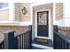 Inviting front door with sidelight, lantern, and brick accents enhancing curb appeal at 2519 Rutherford Way, Charleston, SC 29414