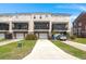 Exterior view of townhouse with attached garages and landscaped front yards at 2519 Rutherford Way, Charleston, SC 29414