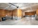 Unfinished garage with concrete floor, cinder block base walls, and wood frame stud walls ready for customization at 2519 Rutherford Way, Charleston, SC 29414