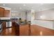 Open kitchen with island, stainless appliances, granite counters, flowing into a dining area at 2519 Rutherford Way, Charleston, SC 29414