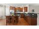 Stylish kitchen with dark wood cabinets, stainless steel appliances, and an inviting center island at 2519 Rutherford Way, Charleston, SC 29414