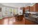 Sunlit kitchen with stainless steel appliances, a central island, and hardwood floors at 2519 Rutherford Way, Charleston, SC 29414